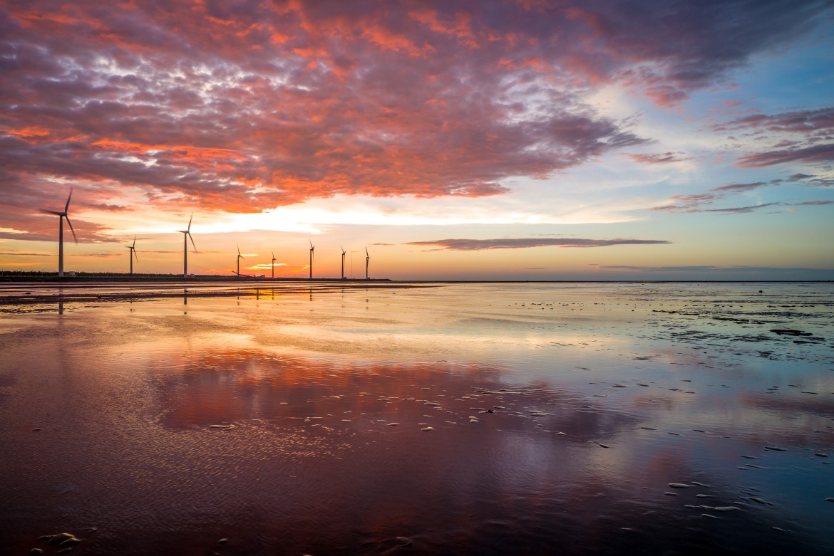 Wind turbines by the sunset