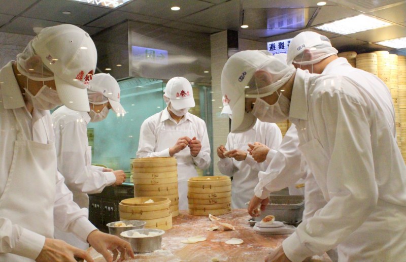 Din Tai Fung dumpling masters making Xiao Long Bao.