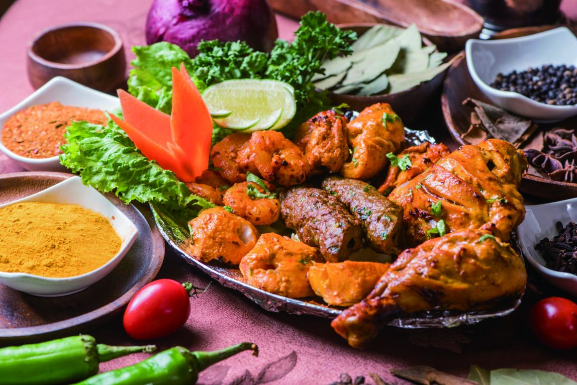 An assortment of fish, chicken and lamb kebabs on a platter, a signature dish from Muslim-owned restaurants. (Photo・Ali Baba's Indian Kitchen)
