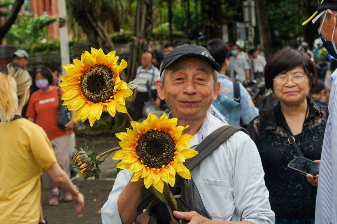 Many protesters used symbols and placards referring to the Sunflower Movement 10 years ago.
