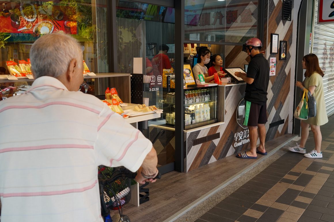 People place orders at a Good Morning breakfast shop.