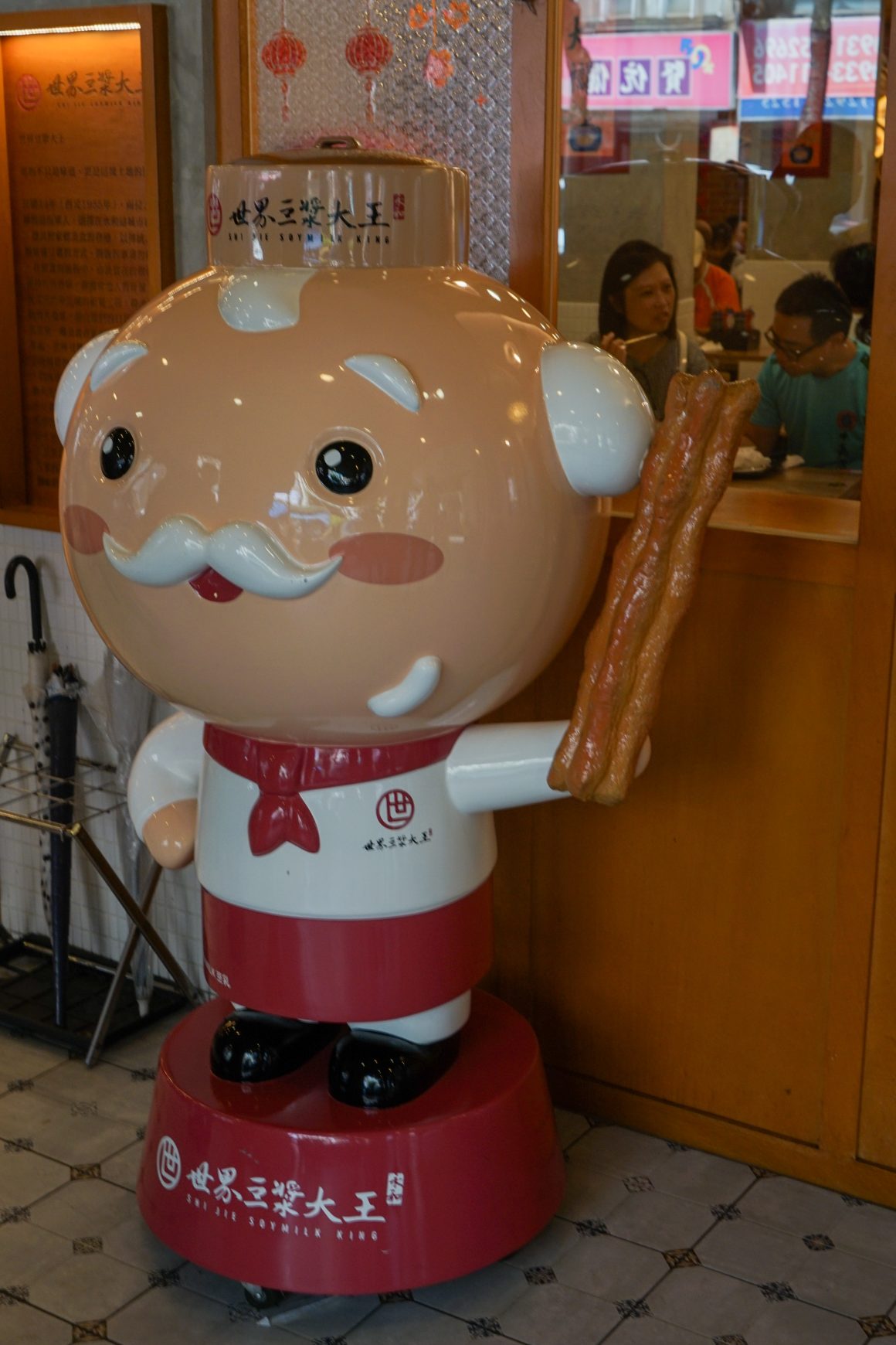 A mascot stands in front of the Shijie Soymilk King restaurant in New Taipei City's Yonghe District, one of the oldest soy milk shops in metropolitan Taipei.
