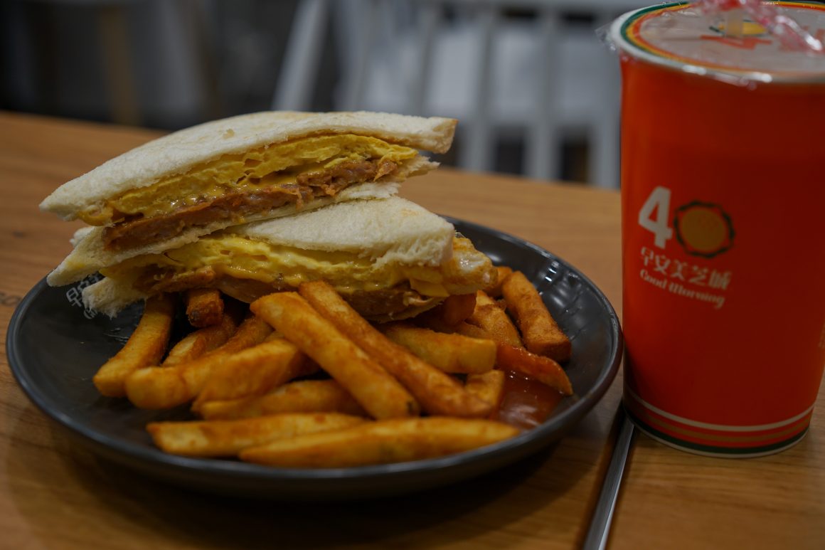 A chicken sandwich and French fries at a Good Morning breakfast shop. 