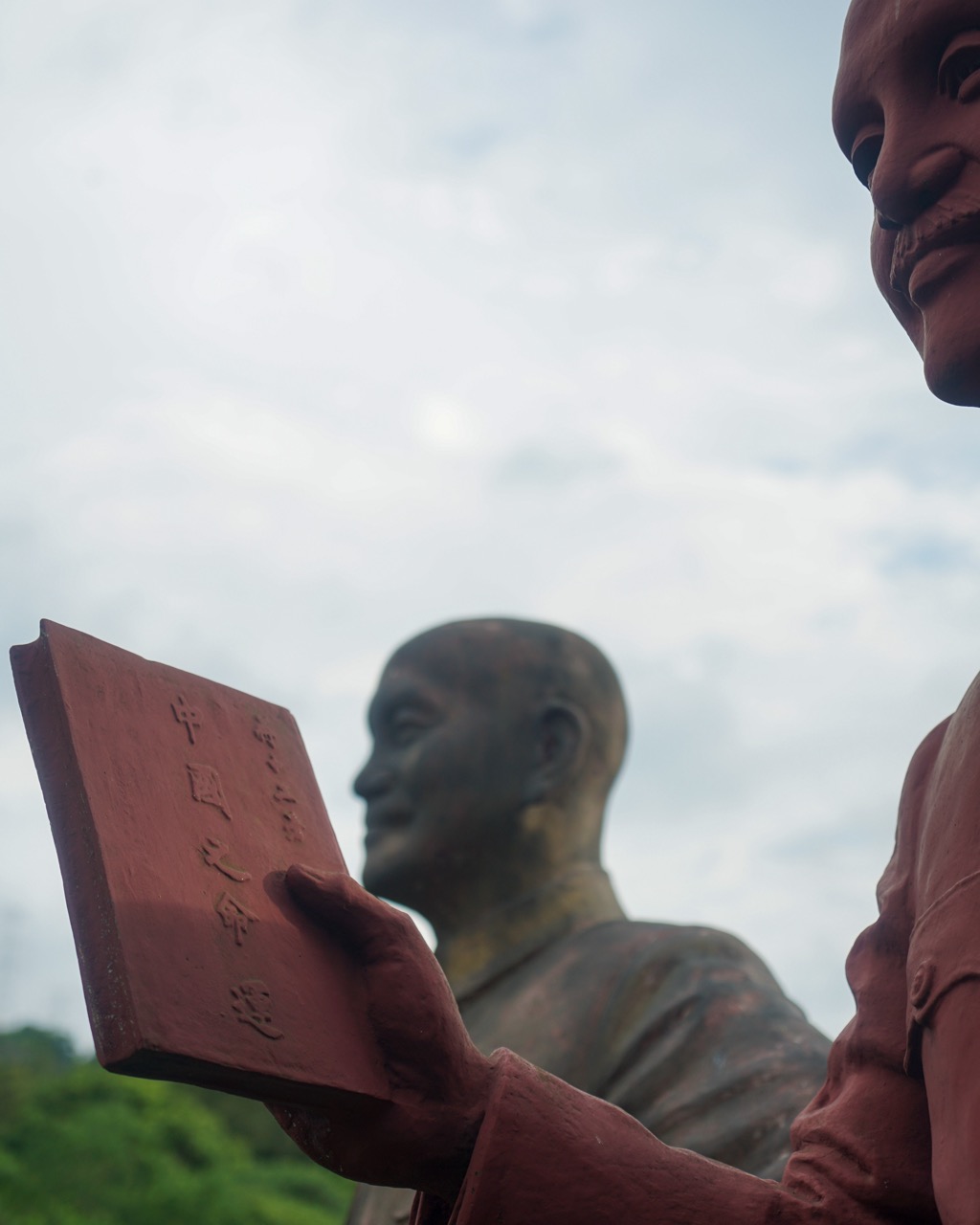 Several statues feature Chiang reading from his magnum opus “China's Destiny.”