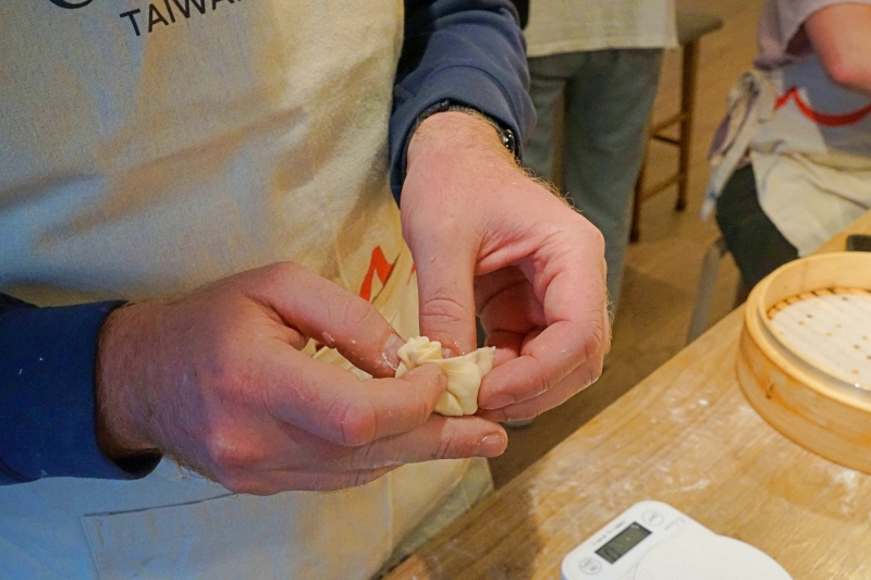 Folding the dough around the filling is the hardest part when making xiaolongbao(小籠包).